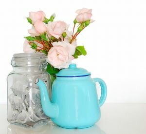 beautiful teapot with flowers and tea bags